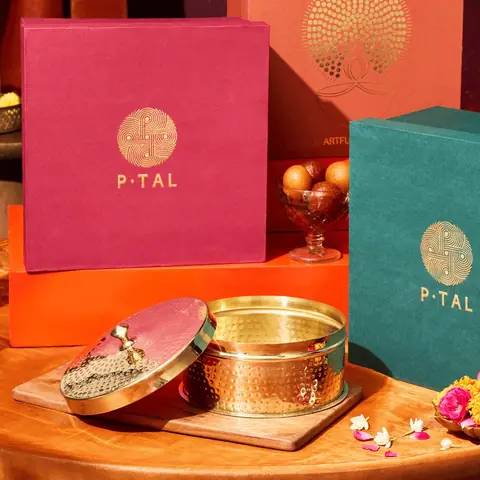 Box and gift boxes on an orange and red cloth
