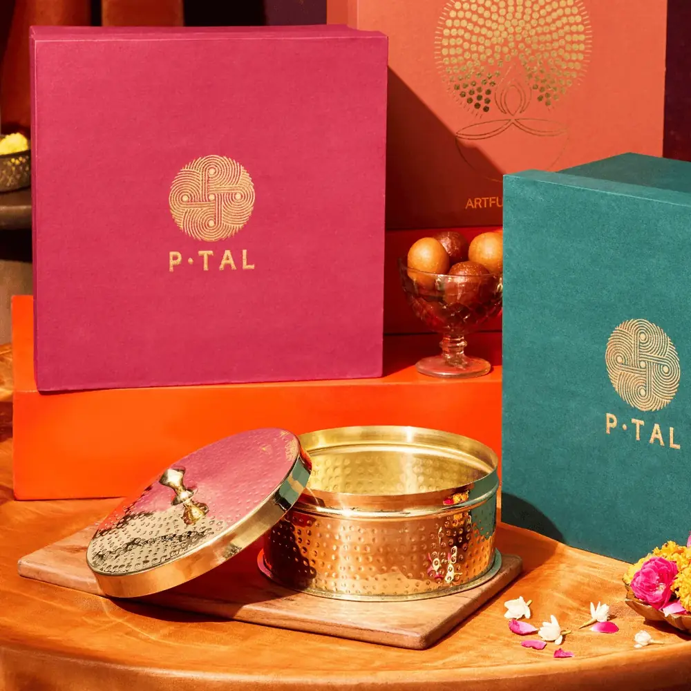 Box and gift boxes on an orange and red cloth