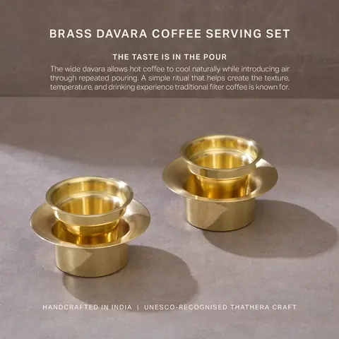 Brass davara and tumbler pair on a brown ground