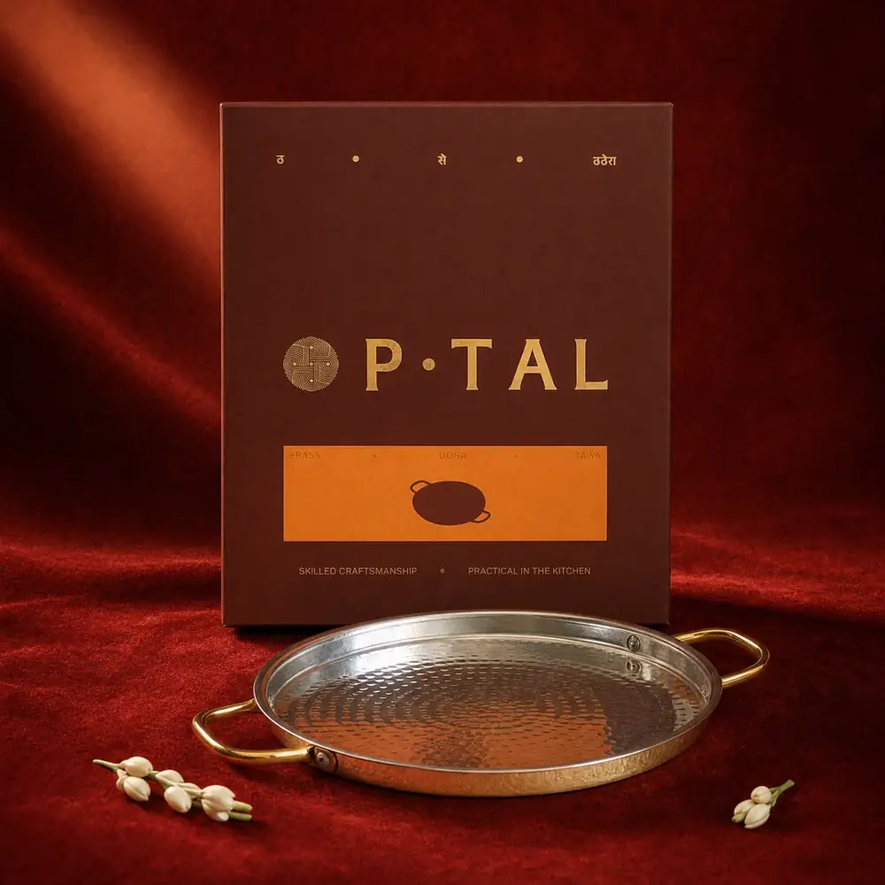 The tawa in front of its box on a red cloth