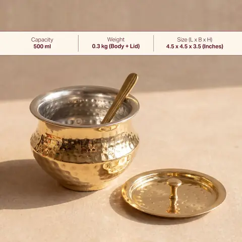 The open pot with a tin lining, the lid and spoon beside it, and a size strip across the top