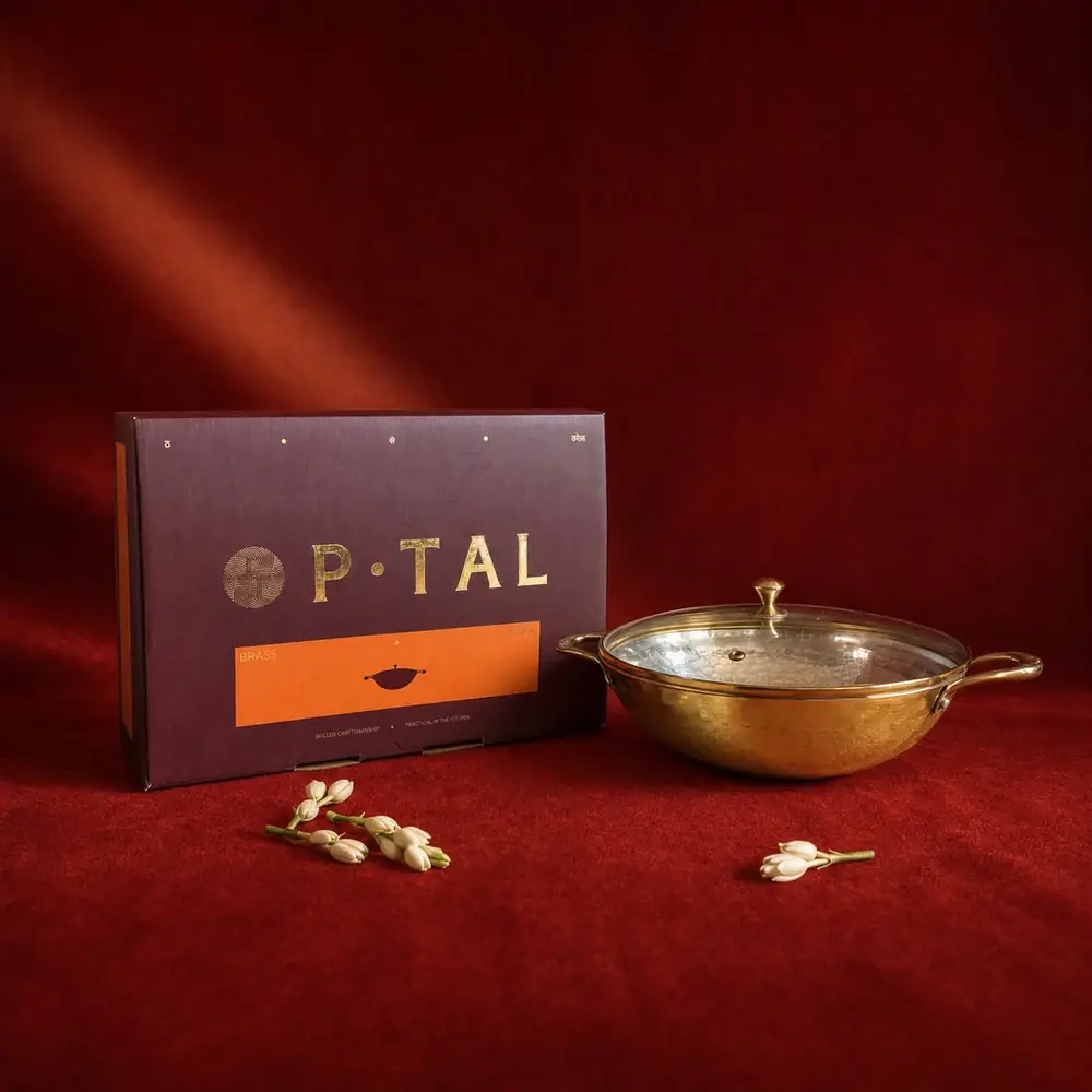 The kadhai and its box on a red cloth