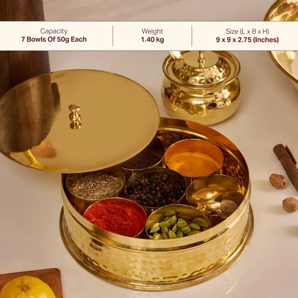 Open spice box filled with spices on a cream ground
