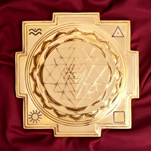 Top view of the Shree Yantra pattern with symbols at the corners