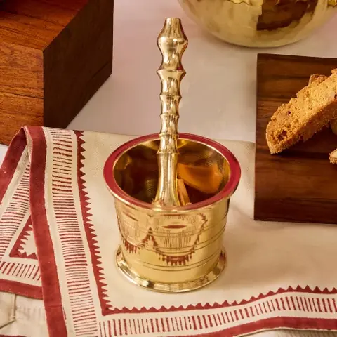 The pestle in the mortar on a printed cloth