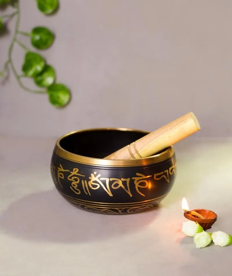 The bowl with the stick resting on it