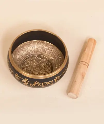 Inside of the bowl with the stick beside it