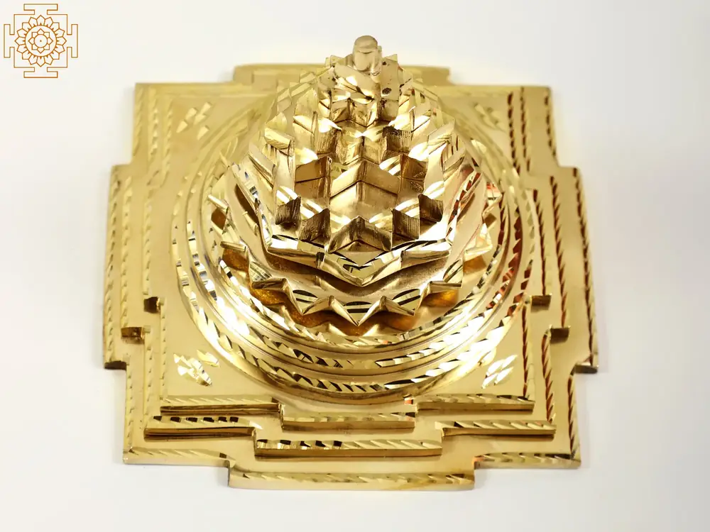Gold brass stepped Sri Yantra on a white ground