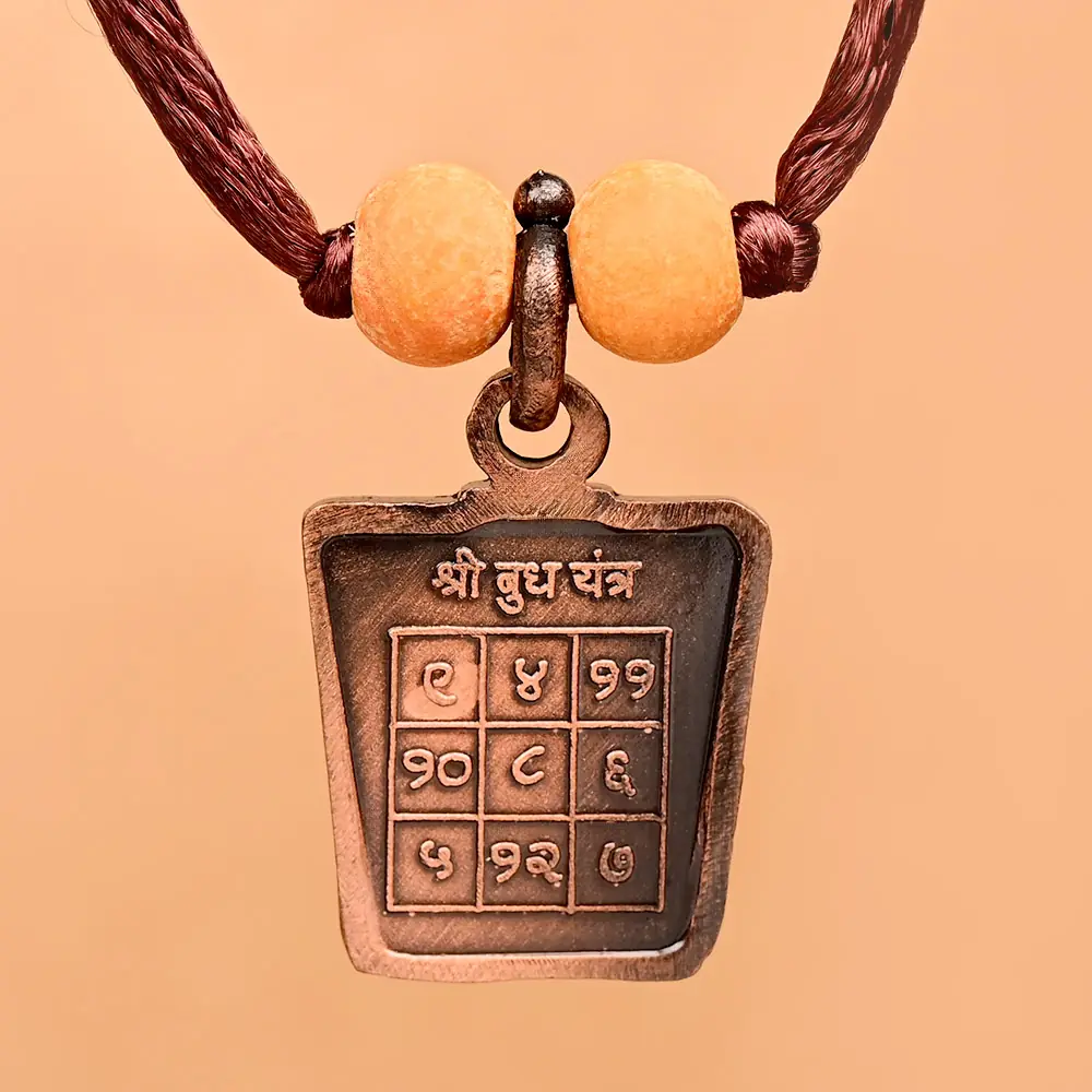 Buddh yantra side of the copper locket on a thread