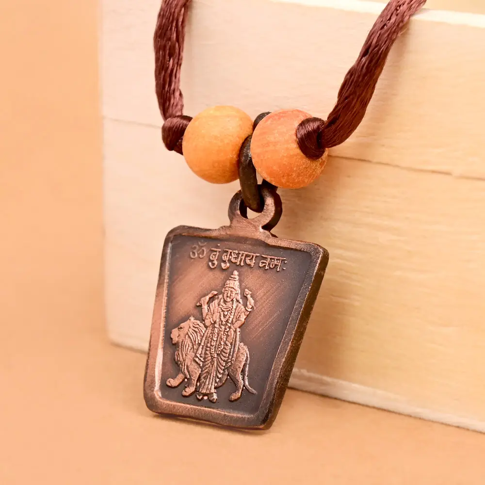 The deity side on a brown cord with two beads