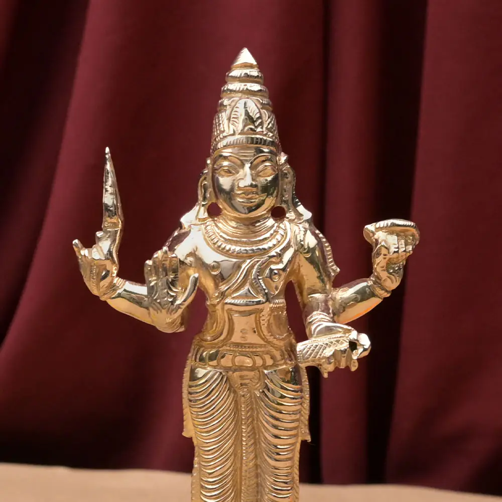 Close view of the crowned face and arms