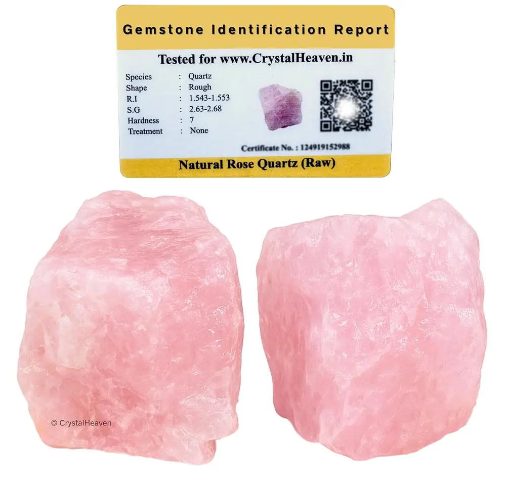 Two raw rose quartz pieces beside an identification card