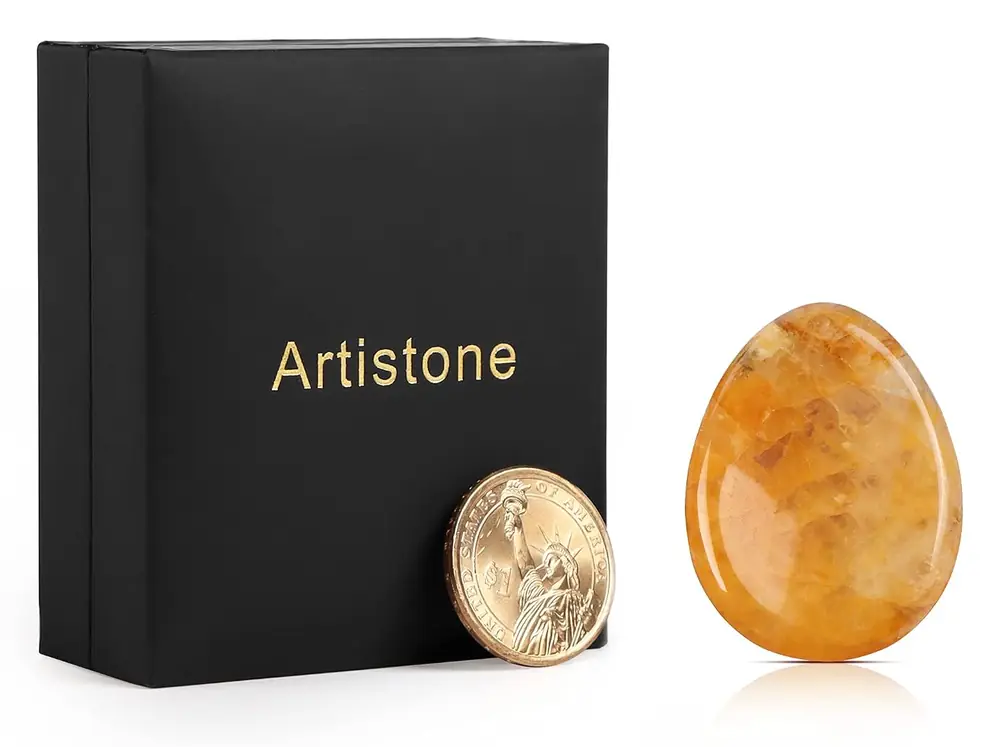 The stone beside a black Artistone gift box
