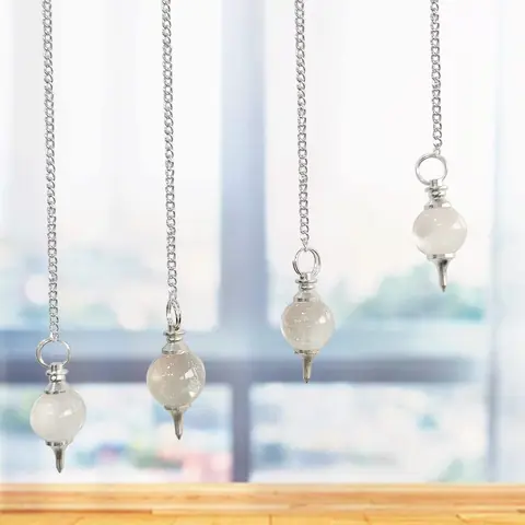 Several quartz pendulums hanging in a row