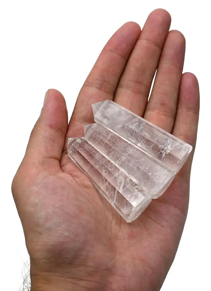 The quartz tower held in a hand to show its size