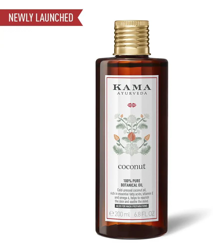 Brown glass bottle of Coconut Botanical Oil with a gold cap