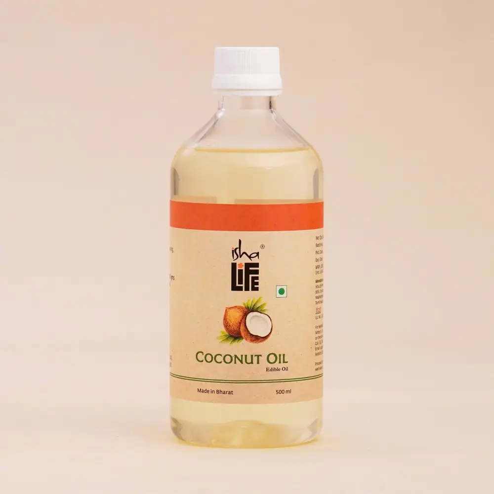 Coconut oil bottle on a stone with flowers