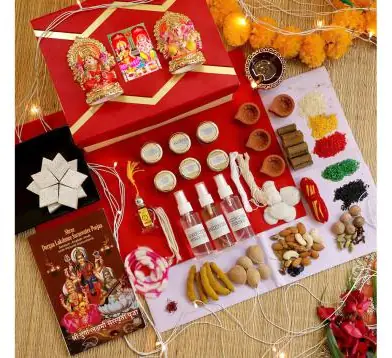 Diwali puja kit contents laid out around the box