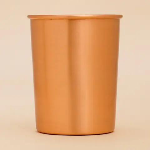 A single plain copper glass seen from the front