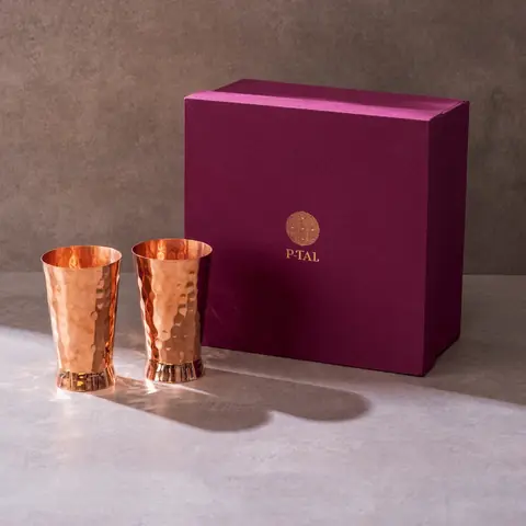 The glasses next to a dark plum gift box