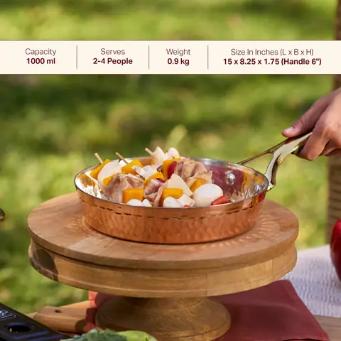 A copper frying pan holding a prepared dish
