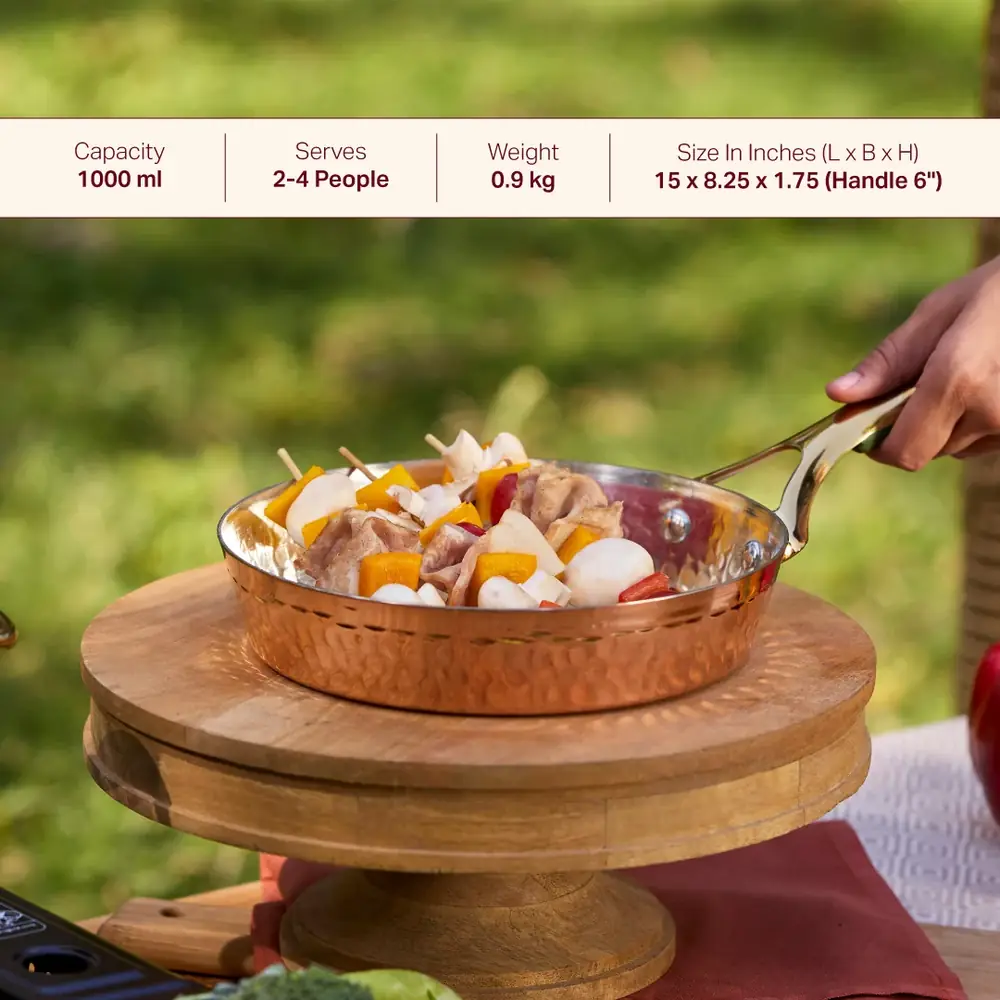 A copper frying pan holding a prepared dish