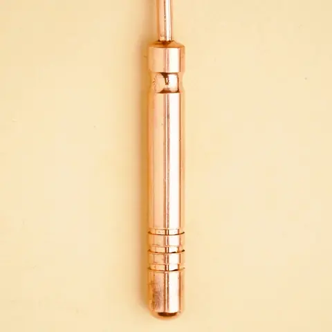 Close view of the ridged copper handle