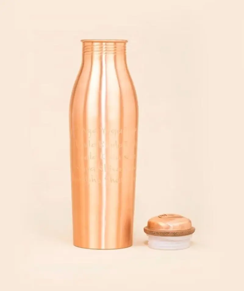 The bottle with its cap resting beside it