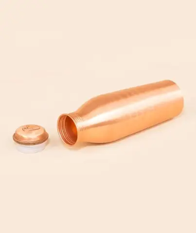 The bottle lying on its side with the cap off