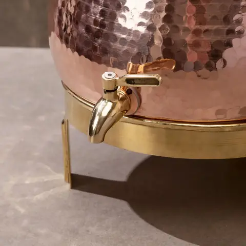 Close view of the tap and hammered surface