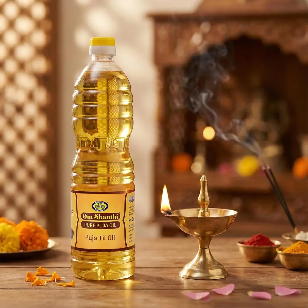 Bottle of Cycle Pure til oil beside a brass lamp and flowers