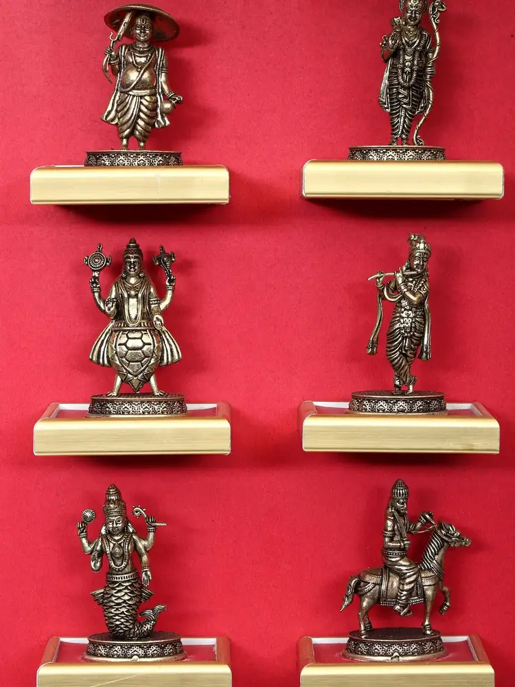 Close view of six figures on the red backdrop