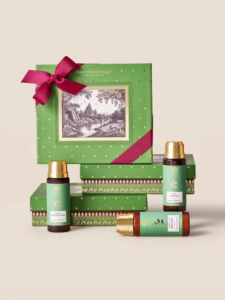 Green Deepa gift box with a pink bow and three bottles
