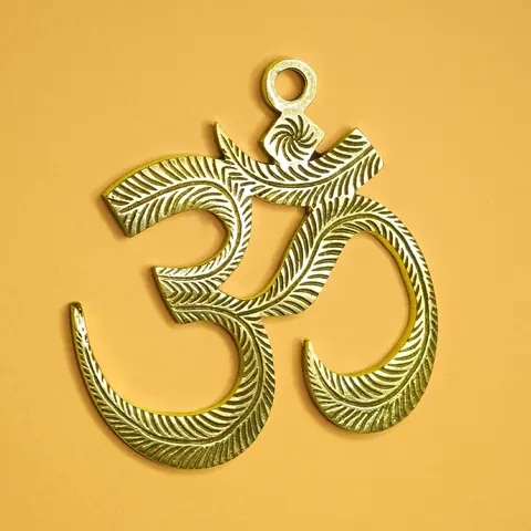 The same Om hanging on a white ground