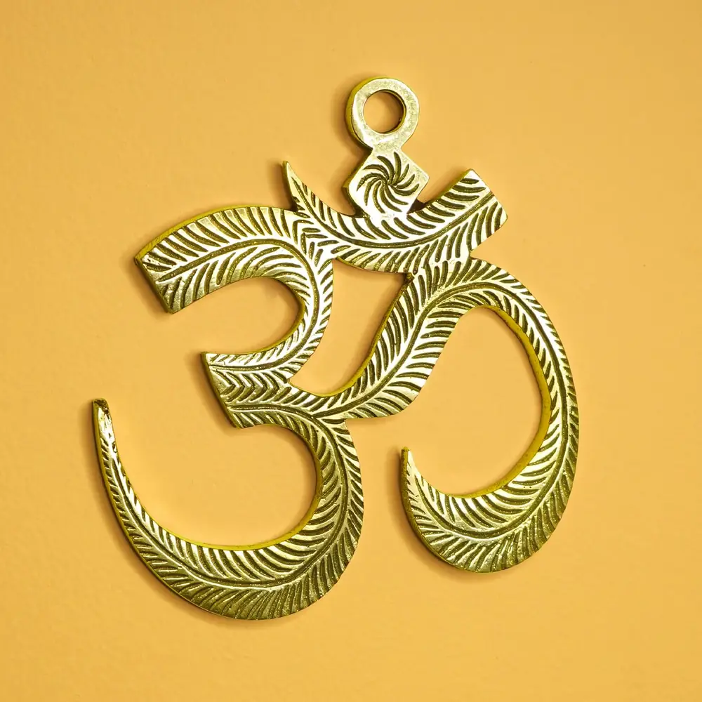 The same Om hanging on a white ground