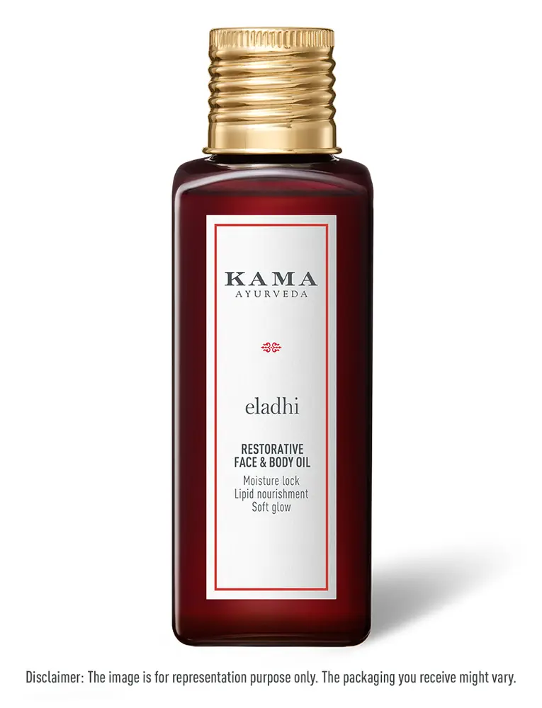 Dark red glass bottle of Eladhi Restorative Face and Body Oil