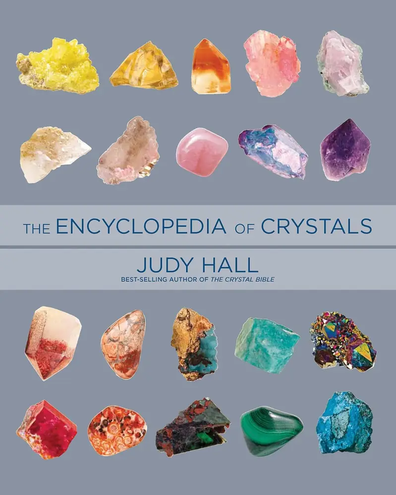 Cover of the Encyclopedia of Crystals by Judy Hall with rows of coloured crystals