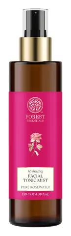 The mist bottle with red rose petals around it