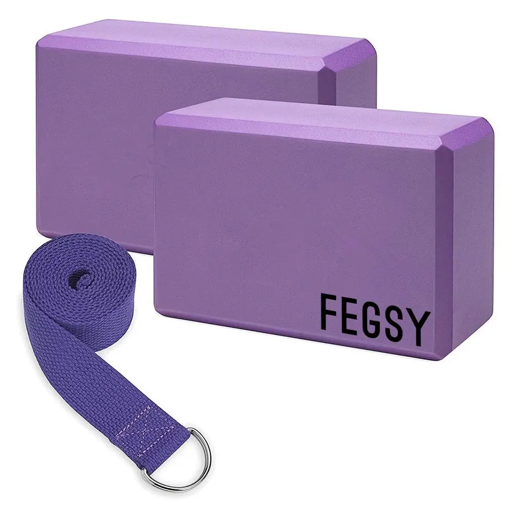 Two purple foam yoga blocks with a purple strap