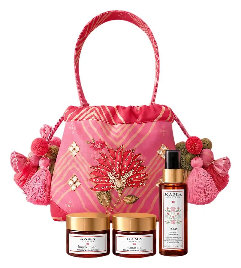 Pink embroidered potli with tassels and three products in front