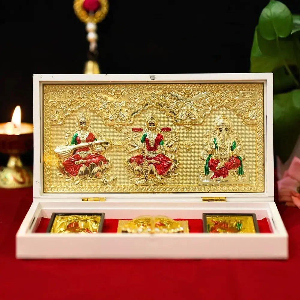 Pocket temple open, showing a gold panel of three deities in a white box lined in red