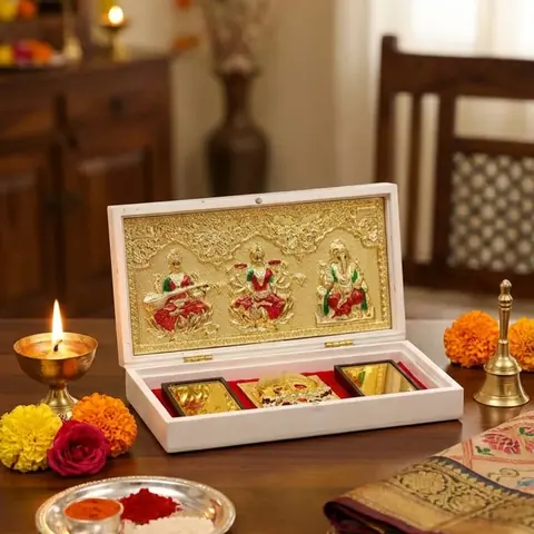 The pocket temple on a wooden table with a lamp and marigolds