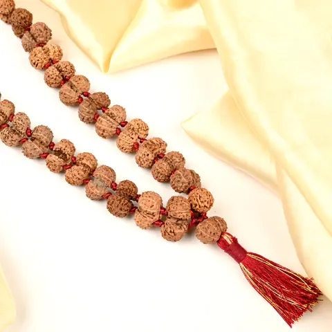 Long strand of the mala with a red tassel