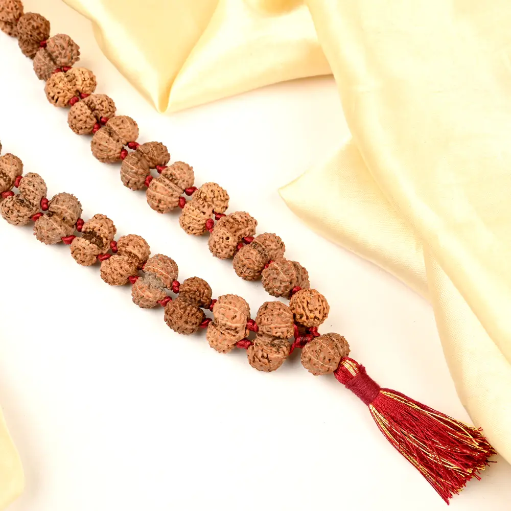 Long strand of the mala with a red tassel
