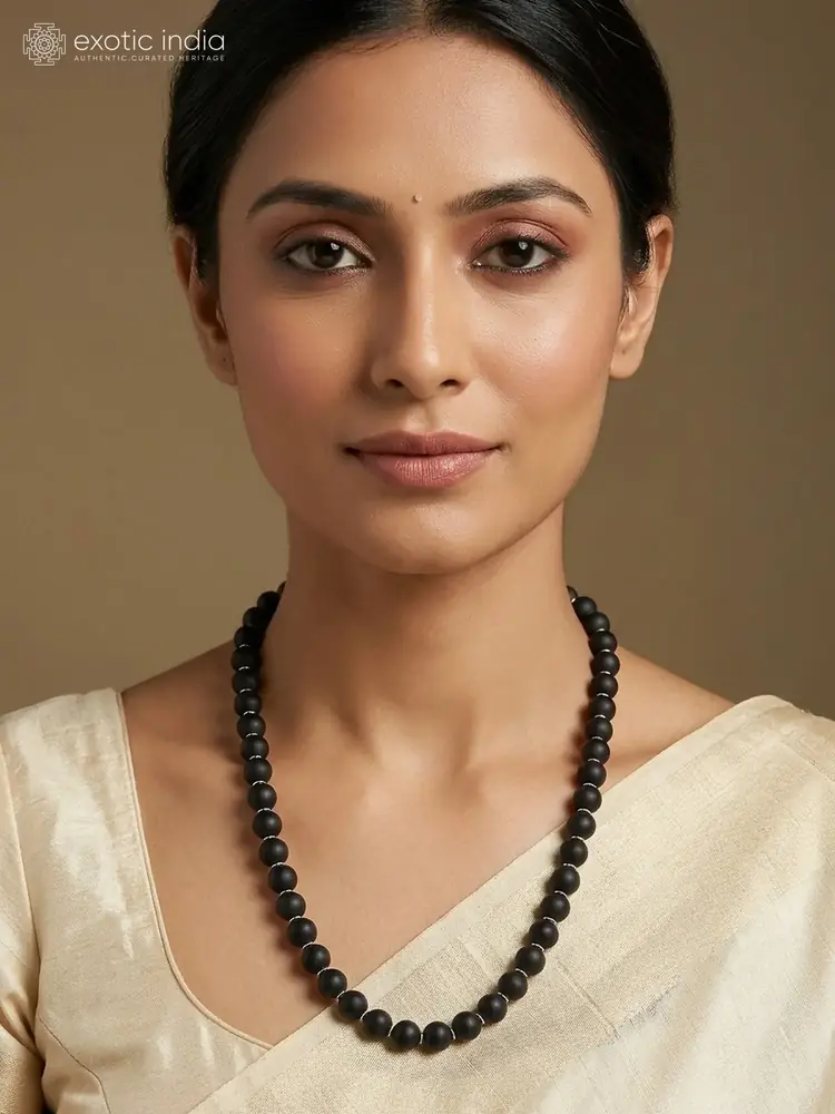 A model wearing the ebony mala
