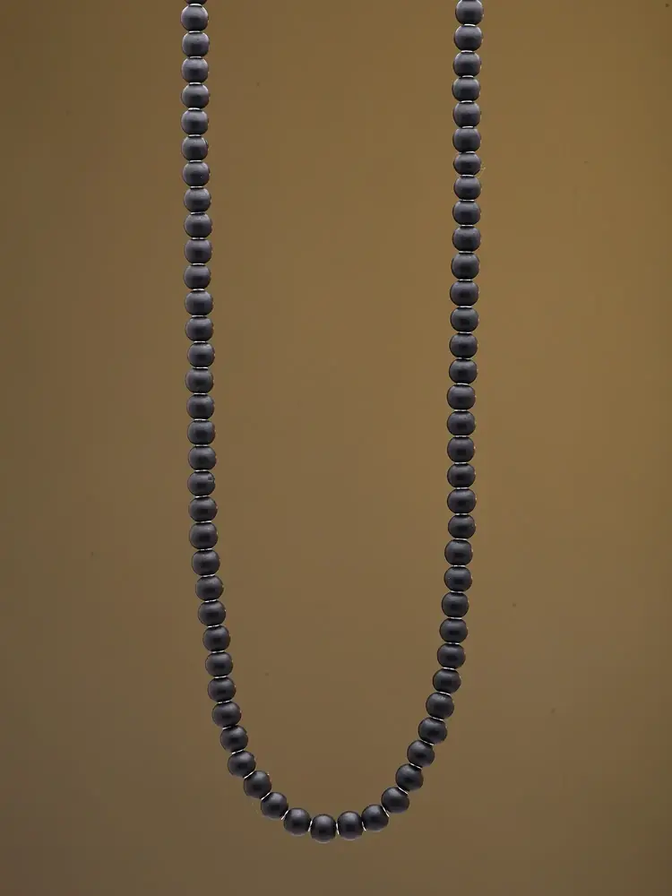 The mala on a dark cloth