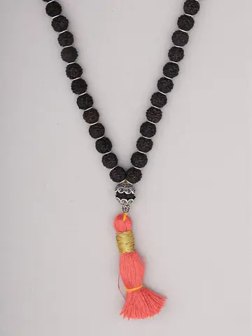 Close view of the silver cap and orange tassel