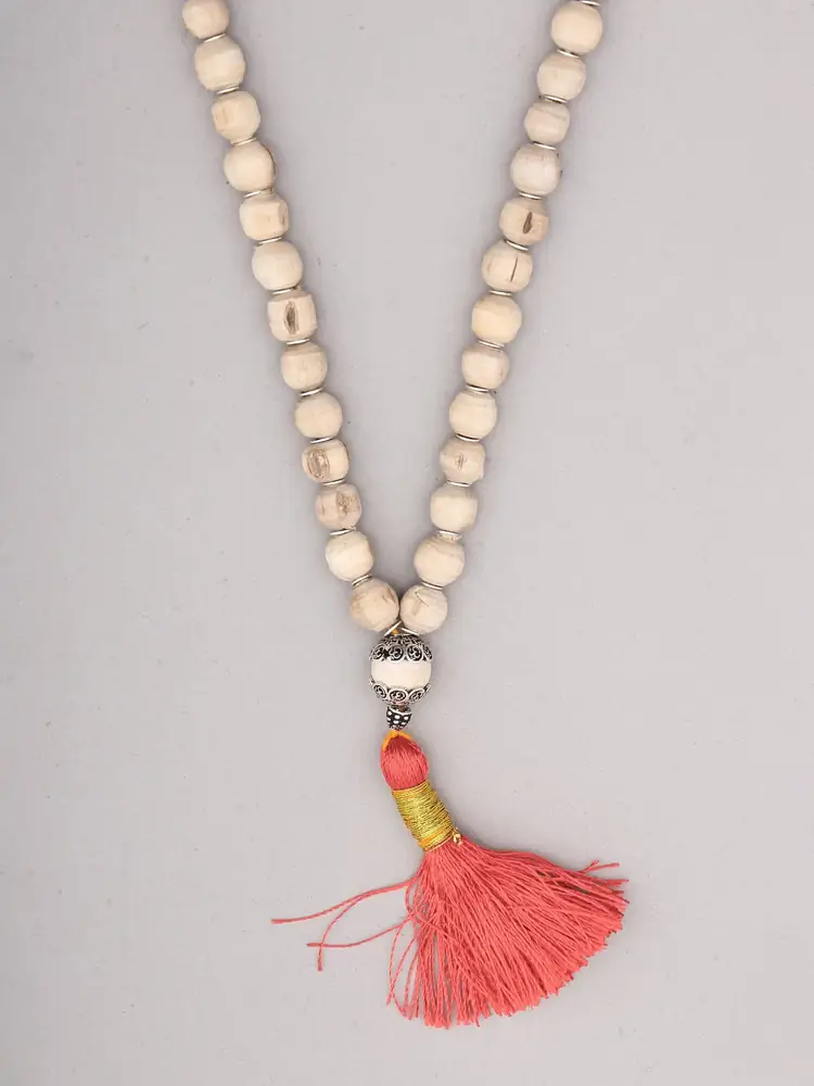 Close view of the silver cap and tassel