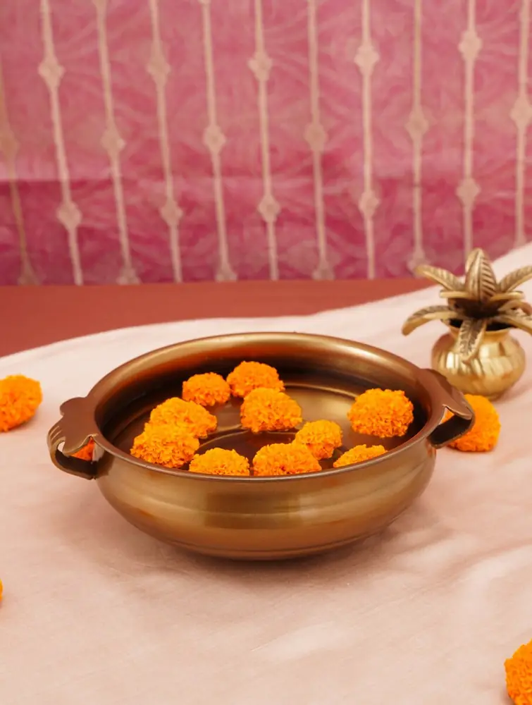 The urli filled with marigold flowers