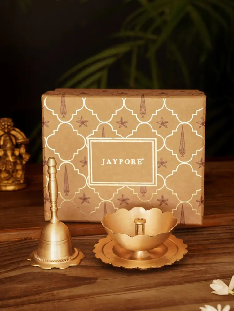 Cream gift box with a brass bell and lotus holder